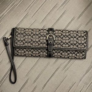 Black logo Coach mini wristlet wallet